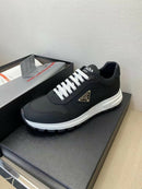 Prada PRAX 01 Sneakers Re-Nylon Brushed Leather Black White