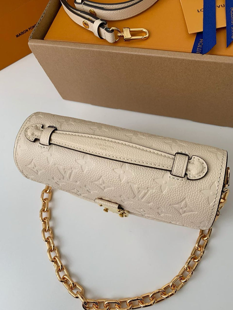 Pochette Métis East West Monogram Empreinte Cream